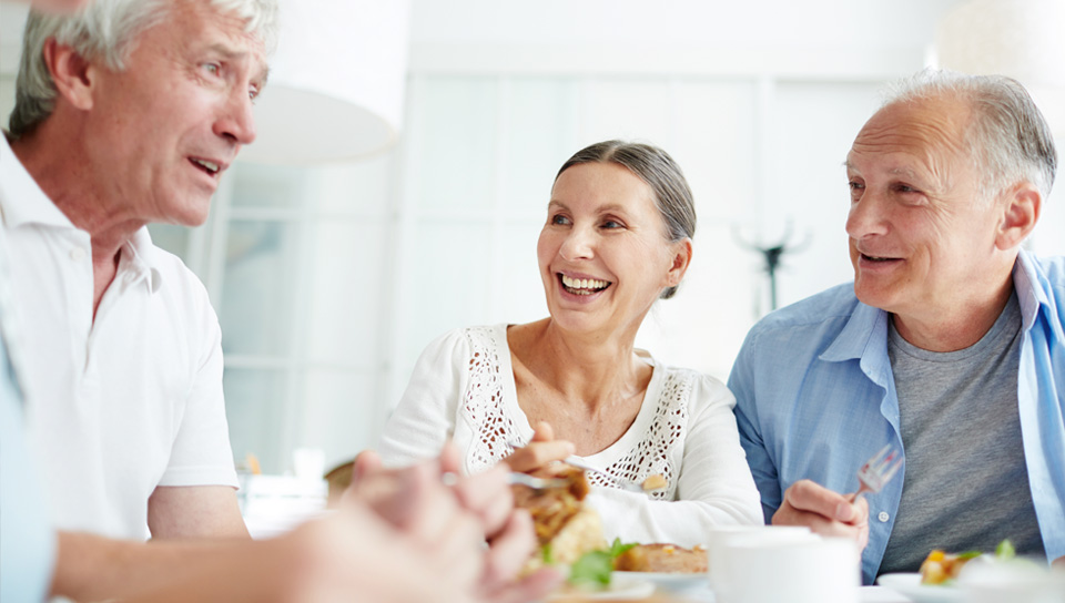 older adults enjoying lunch